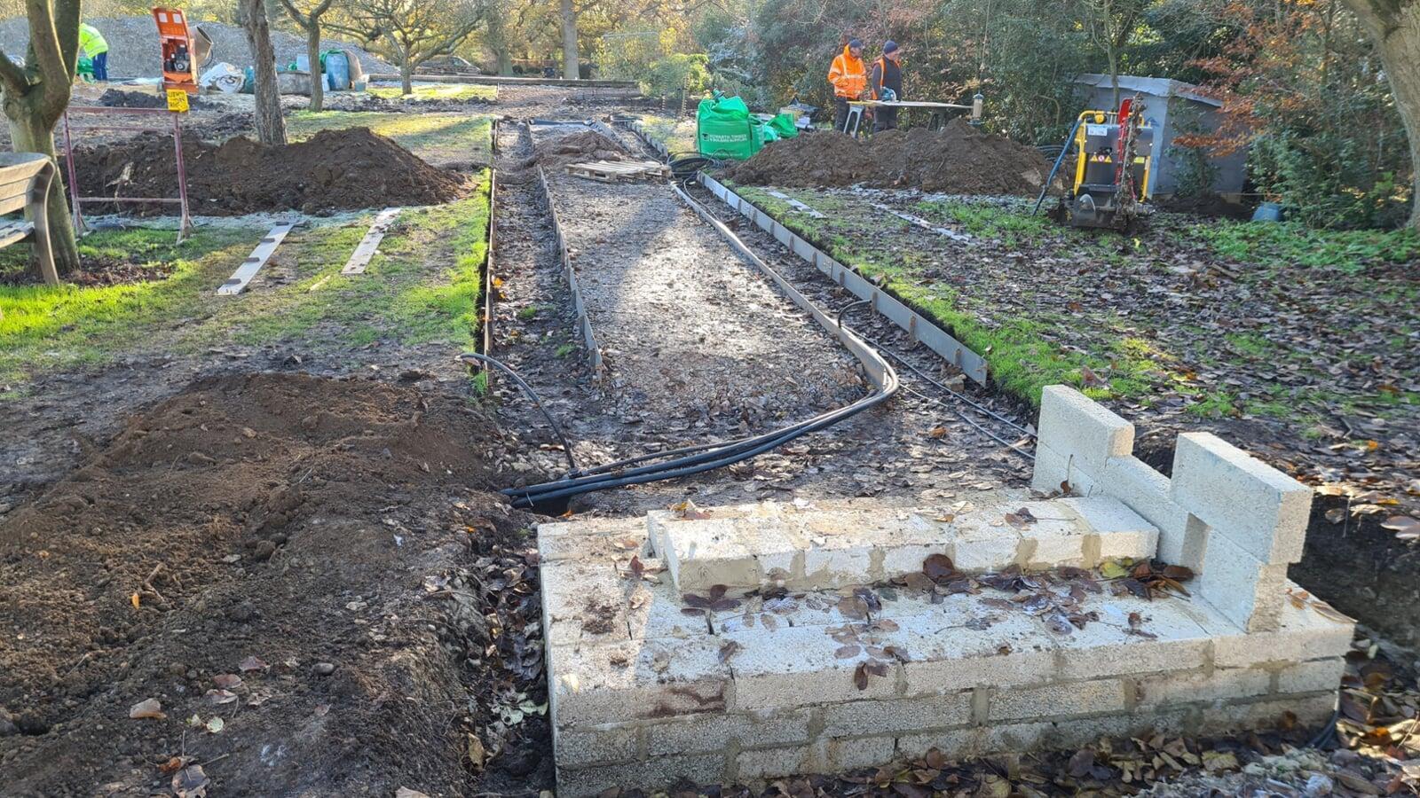 irrigation feed pipes crossing a path